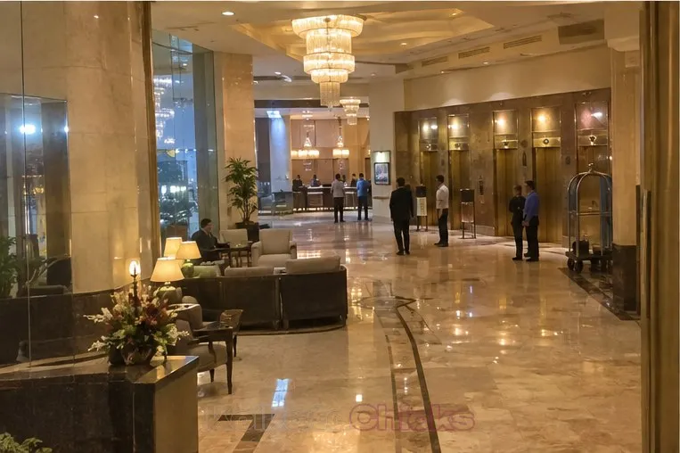 The marble lobby of a big hotel in Kolkata in the evening