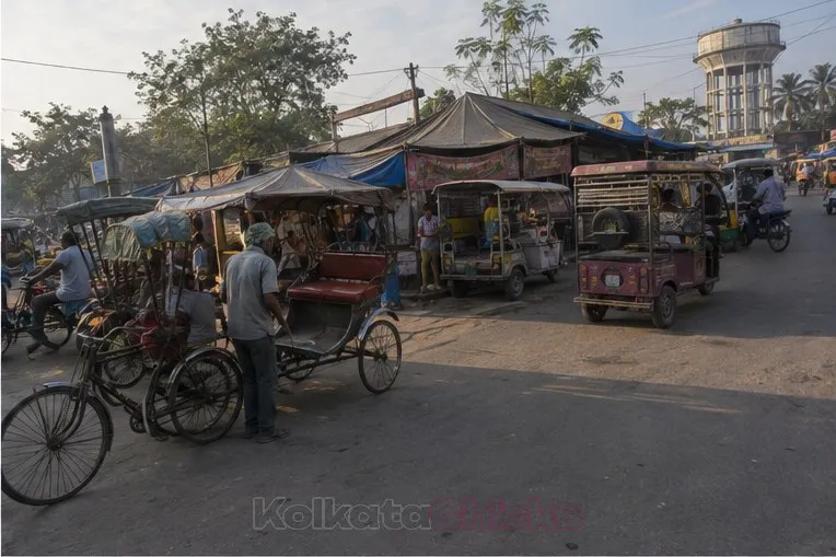 Rickshaws and totos waiting outside a small-town station like Ranaghat